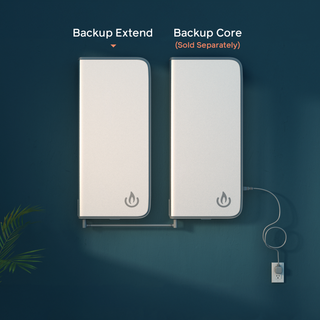 Backup Extend linked side by side with a Backup Core unit. Two slim rectangular cases (power station + extension battery) mounted side by side against a dark teal wall, with text labels reading 'Backup Extend' and 'Backup Core (Sold Separately)'. A power cord is plugged into the right unit.